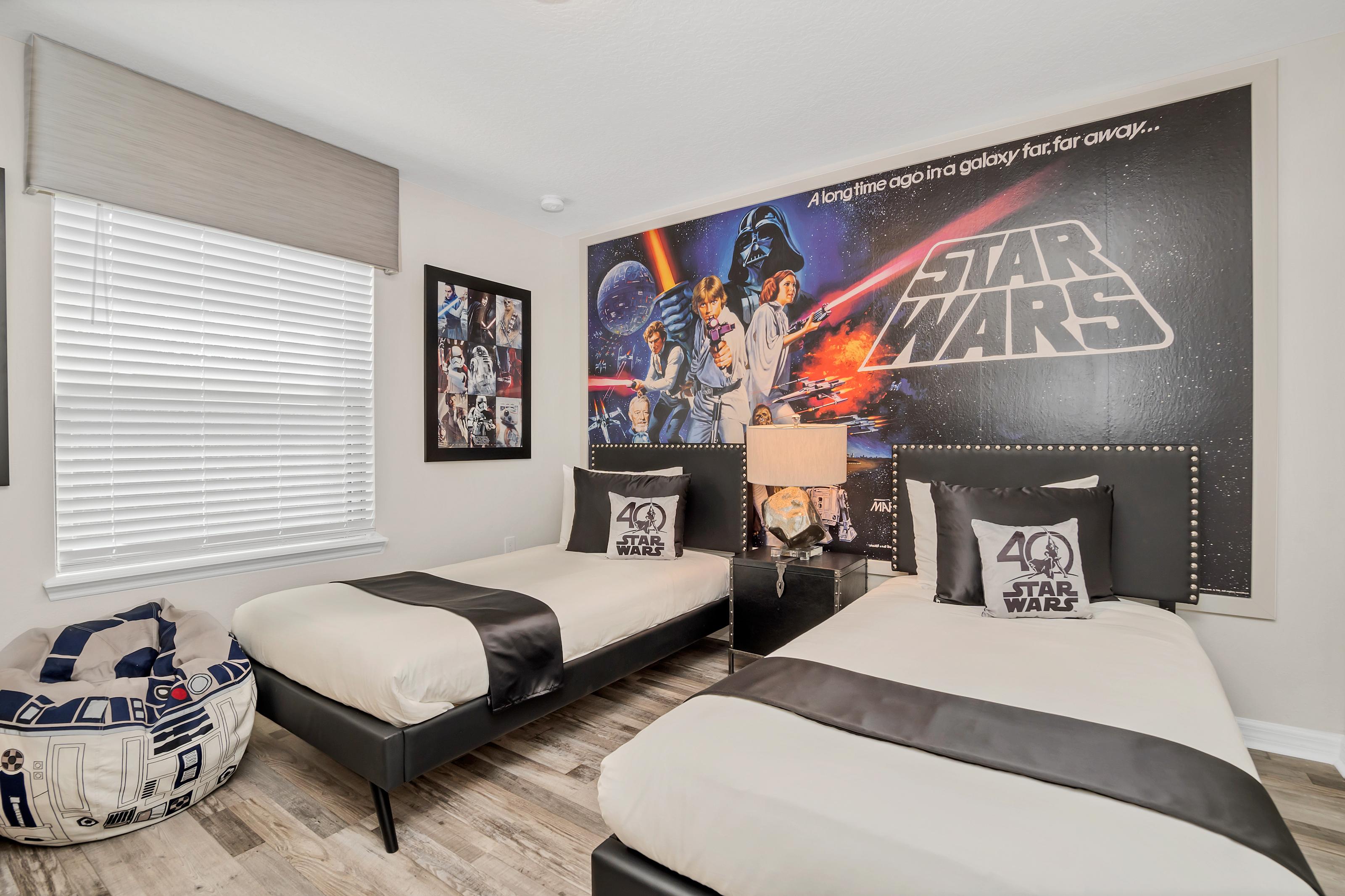 Amazing Star Wars themed twin bedroom with flat screen TV
