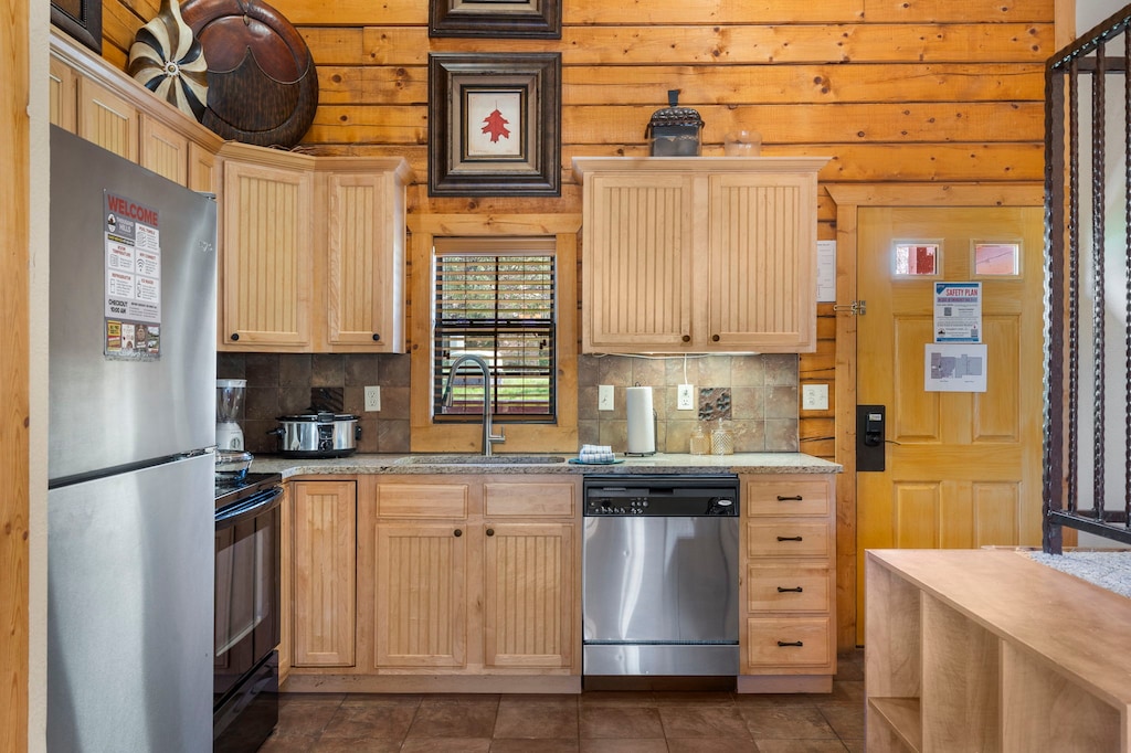 Rustic kitchen with stainless appliances and granite countertops—fully equipped for your stay.