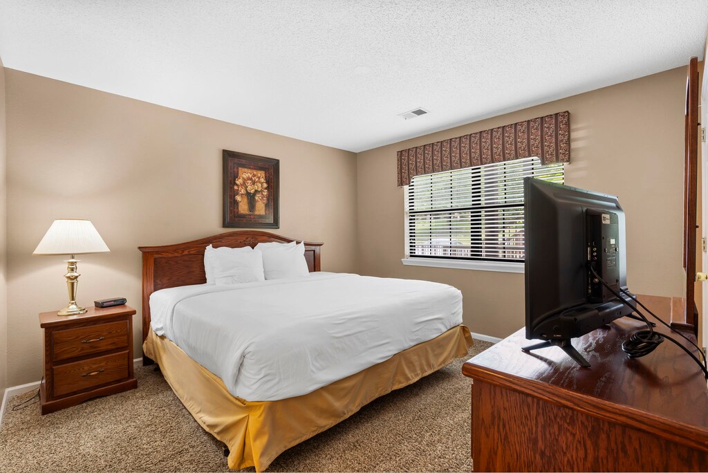 The guest bedroom features a king bed, cable TV, and an attached bathroom.