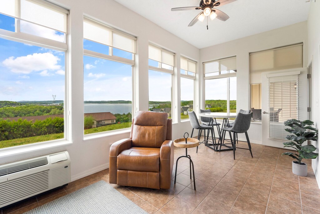 Large Sunroom with a Wall of Lake Facing Windows