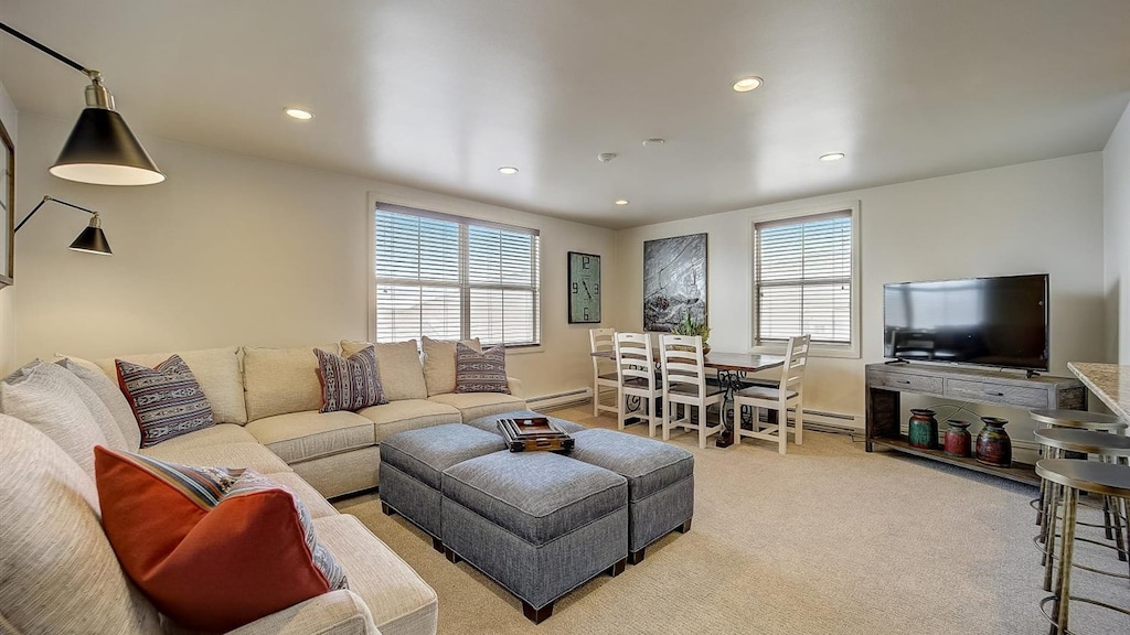 Wonderful living area with eight person couch and eight person dining table.