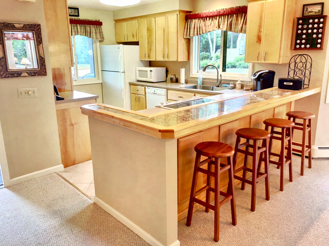 The kitchen is fully stocked for all your cooking needs and features Keurig coffee maker and a breakfast bar that seats 4.