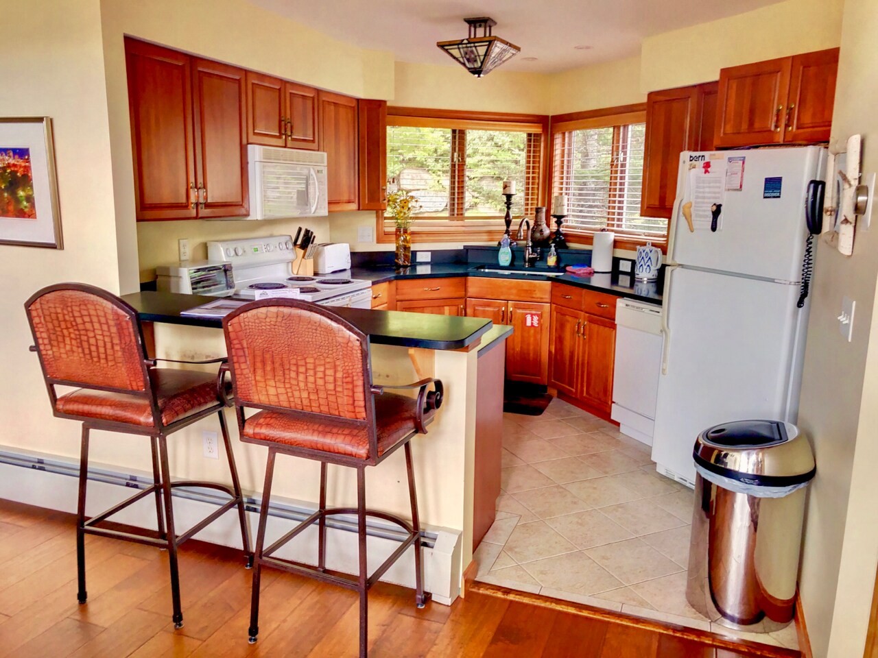 Fully stocked for all your cooking needs with warm cabinets and offer a cozy breakfast bar that seats 2.