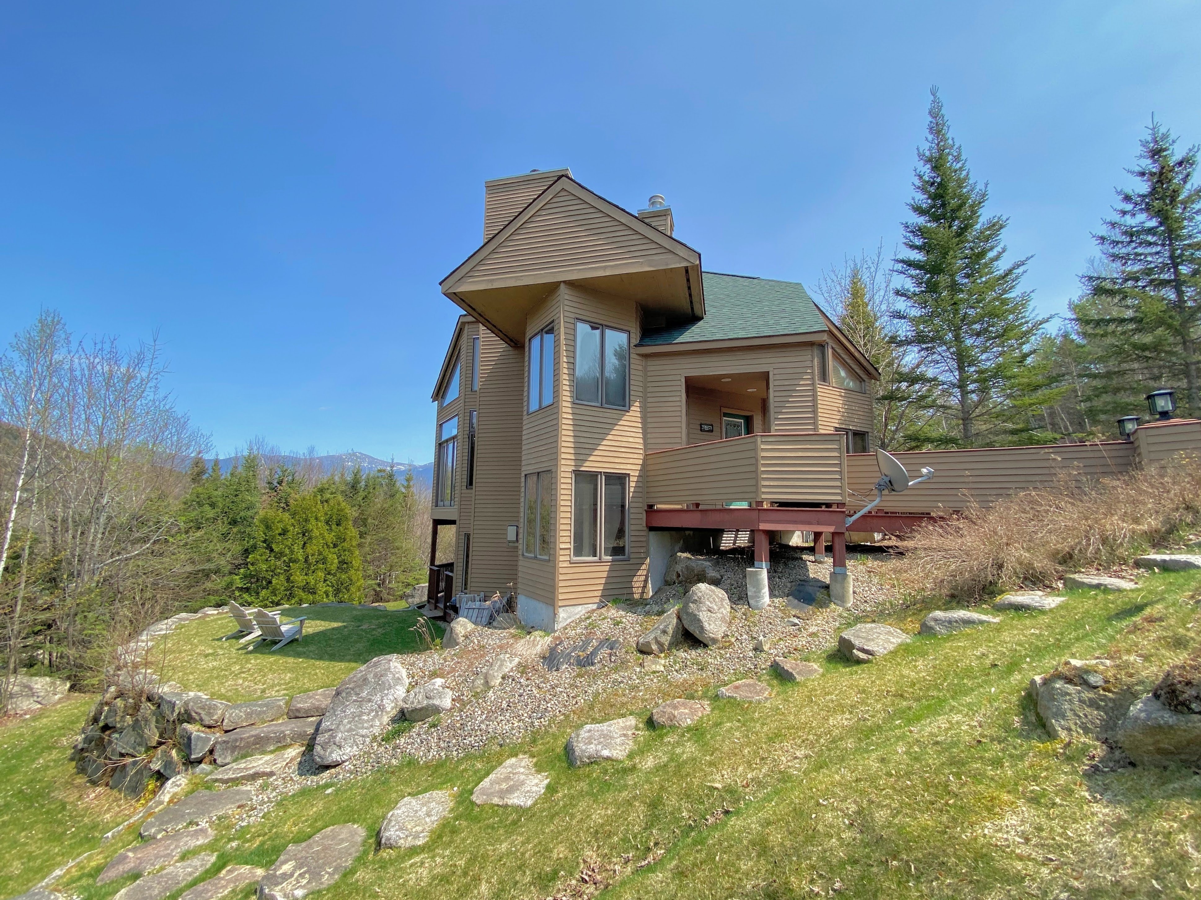 Located in the sought after development of Crawford Ridge, a short walk from the famous ski trail of Bretton Woods, this beautiful home features stunning views of Mount Washington and the Presidential Range.