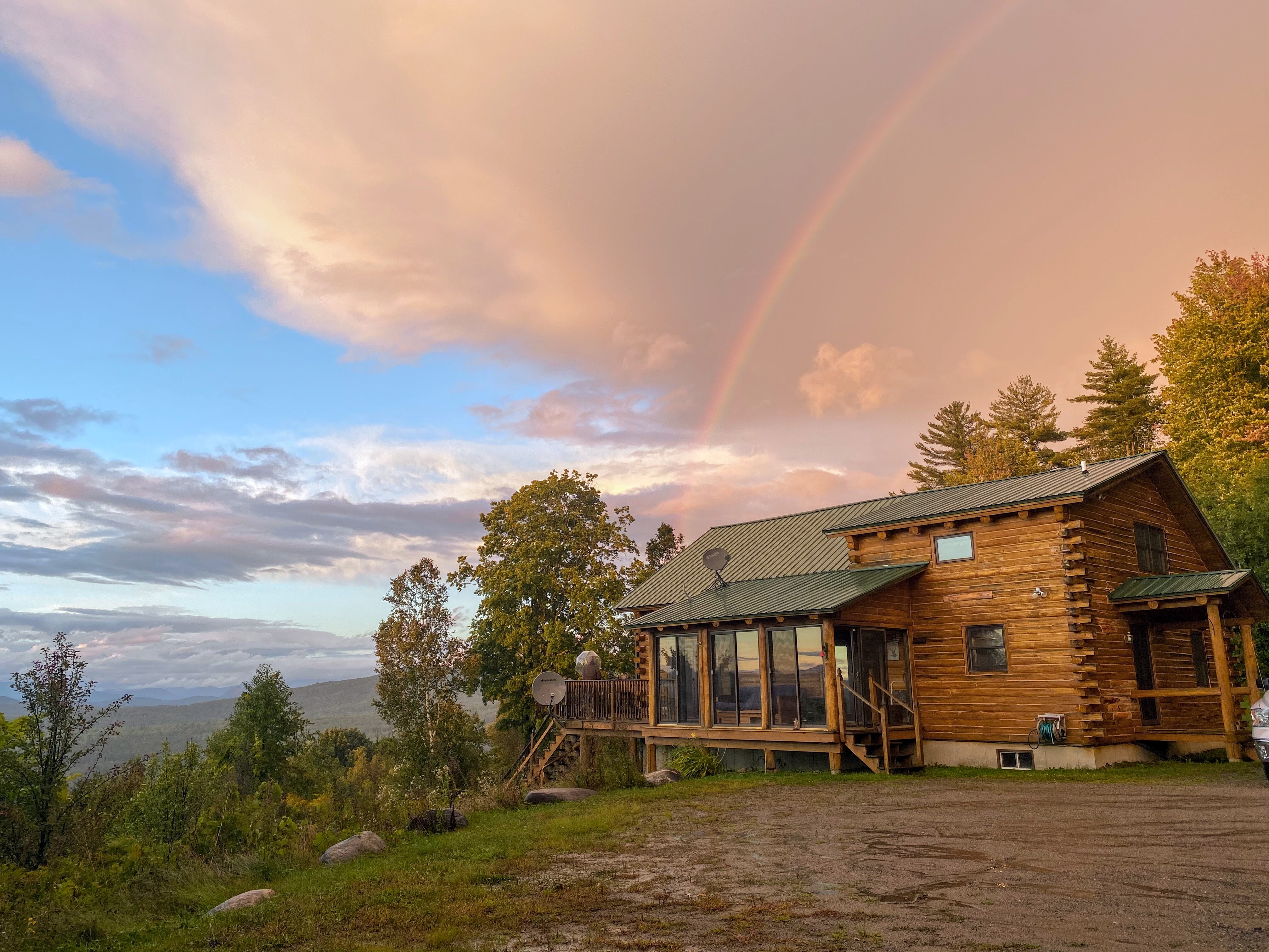 Nestled on a mountainside overlooking Vermont's Northeast Kingdom and the Connecticut River, this quintessential log home combines the charm of traditional log houses with modern comforts and amenities, including granite countertops and stainless steel ap