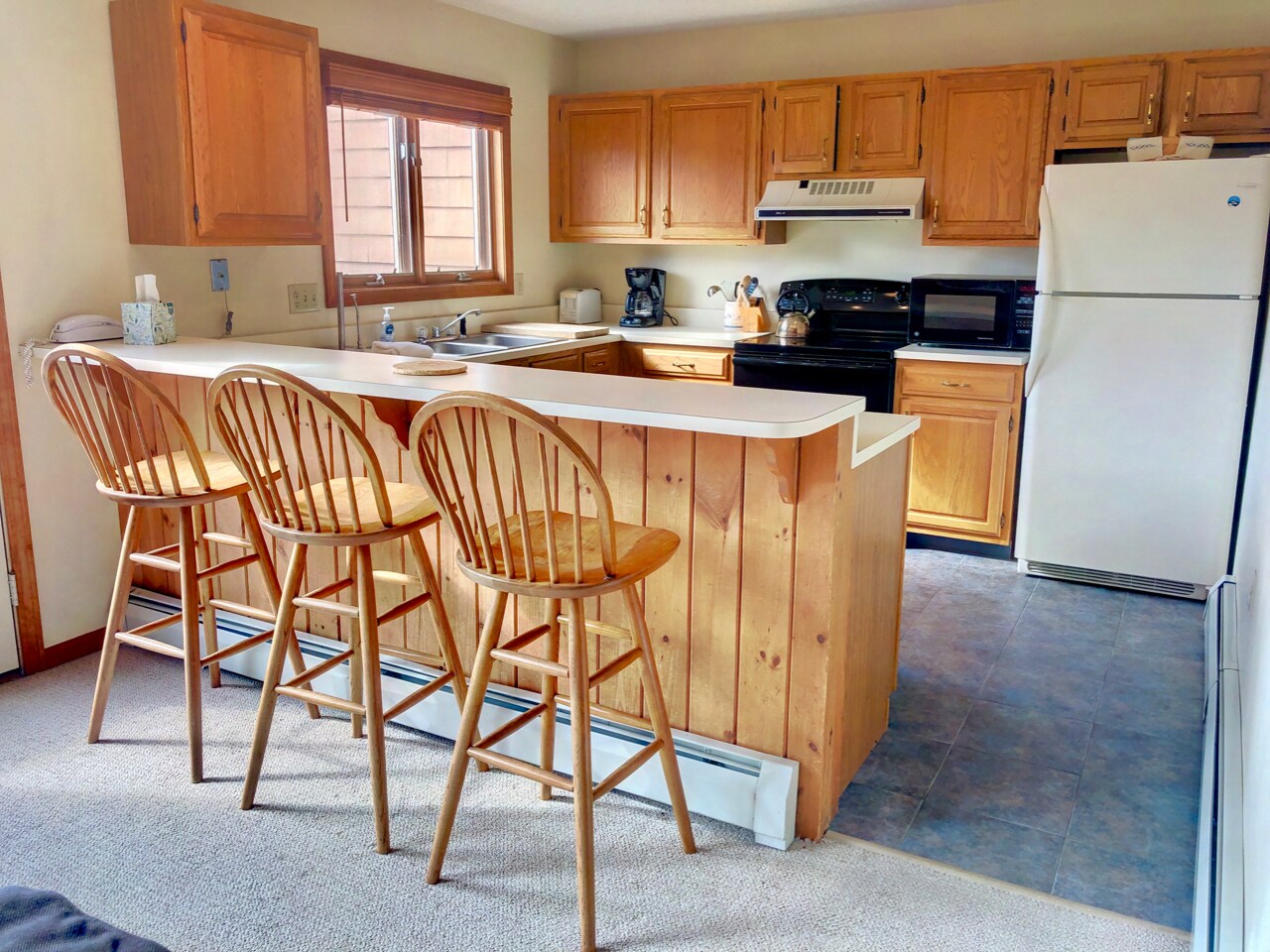 The kitchen has a fully stocked for all your cooking needs and offers a drip coffee maker and cozy breakfast bar that seats 3!