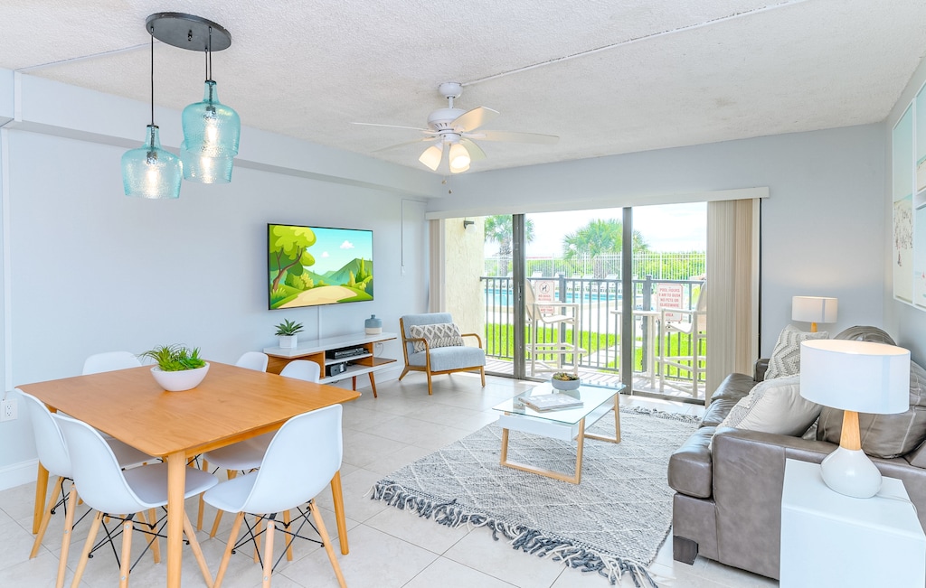 Bright, airy, and just steps from the pool! Relax on the sofa or slide open the doors for fresh air!