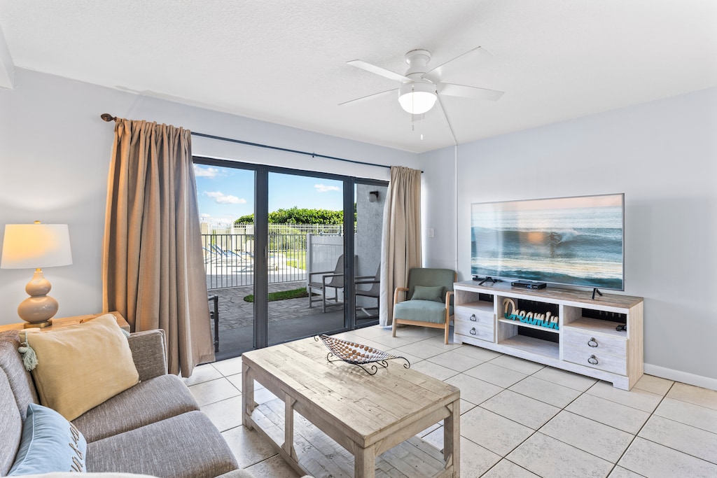 Bright and spacious living area with a walkout patio for indoor-outdoor relaxation
