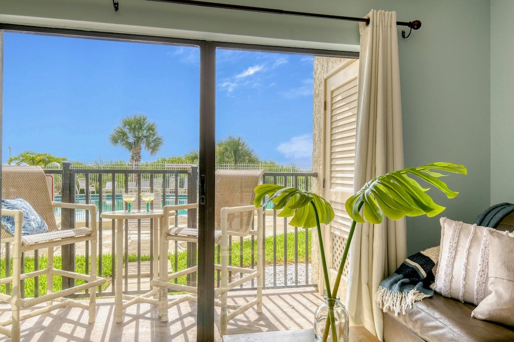 Cozy living space with patio access and fresh ocean air