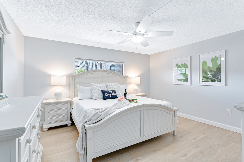 Master bedroom featuring a cozy king-size bed for ultimate comfort