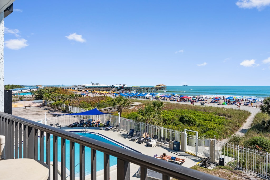 Gorgeous rooftop patio with lounge chairs, ocean views, and relaxation spots.