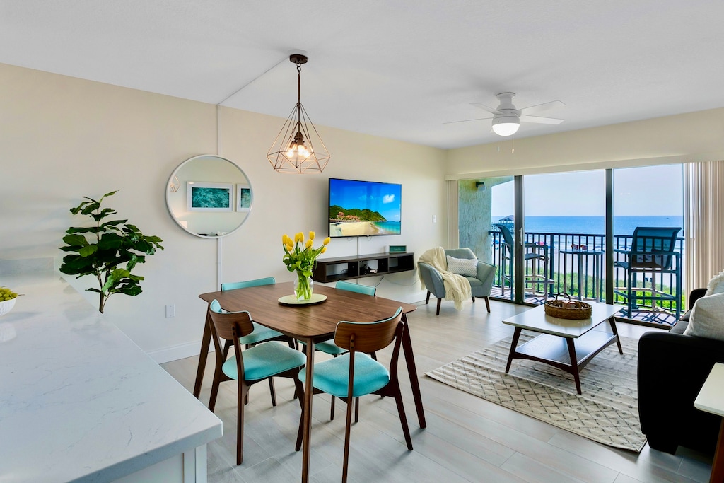 Dining area with an unbeatable view, offering a seamless indoor-outdoor experience.