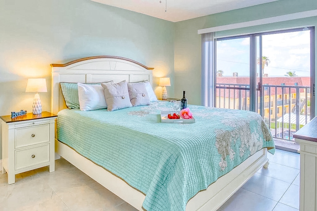 Sleep soundly in a serene master bedroom with a plush king bed