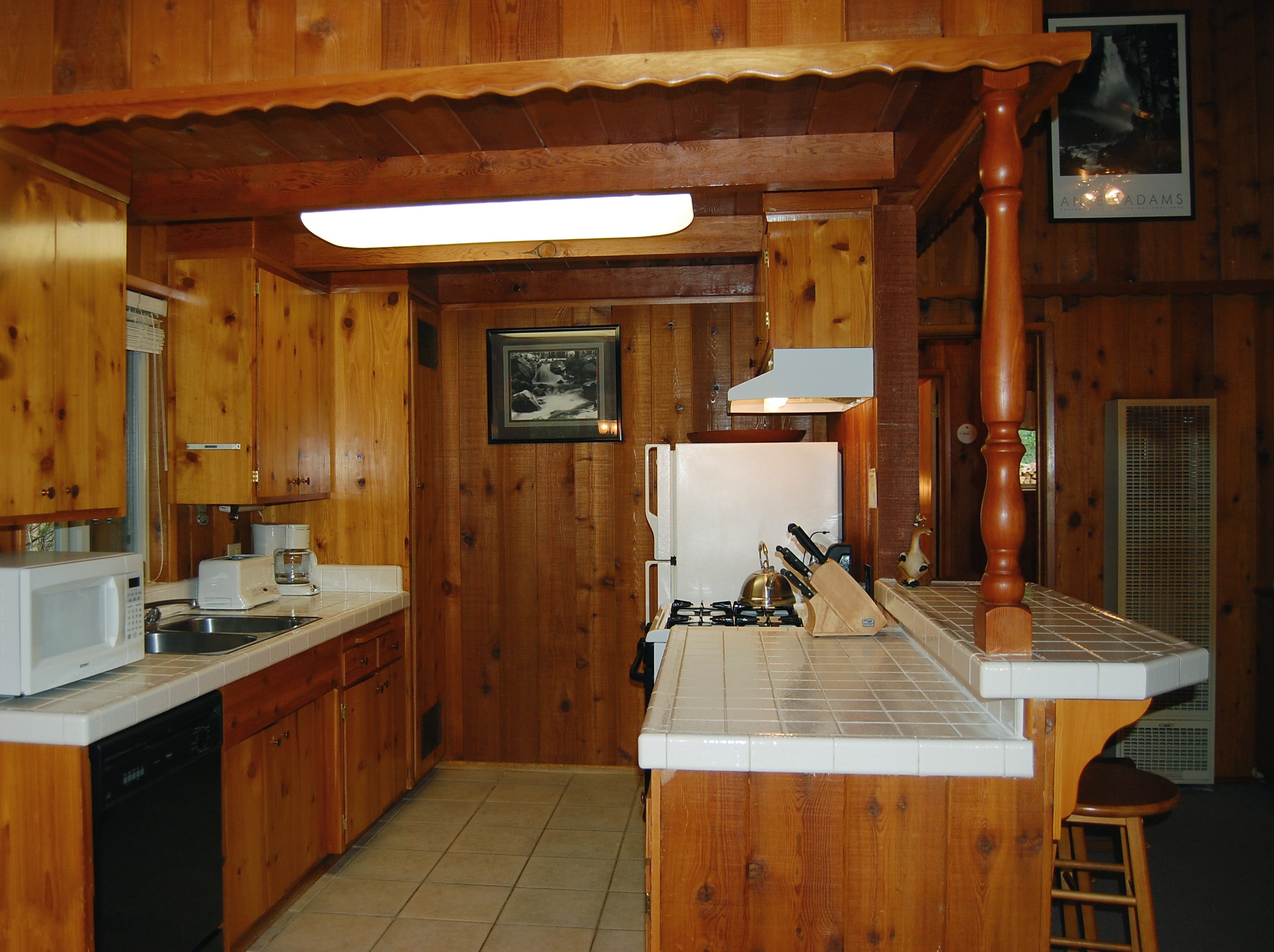 Kitchen with additional seating at bar for 2