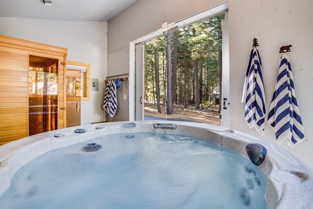 Hot tub and sauna in detached spa.