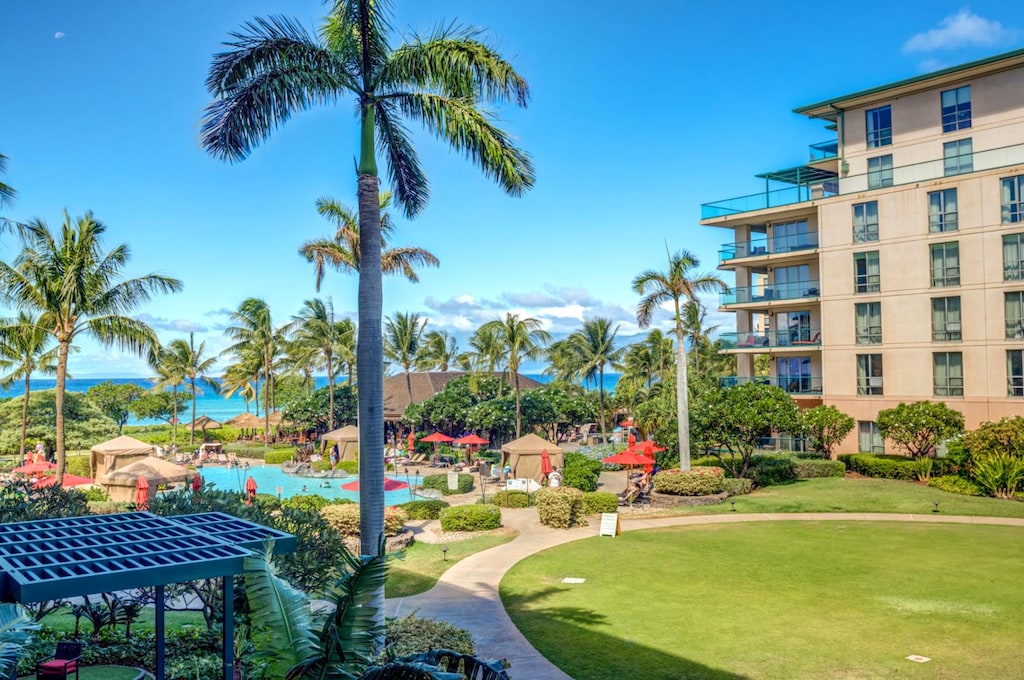 Wake up to waves and wind-kissed palms just beyond your lanai.