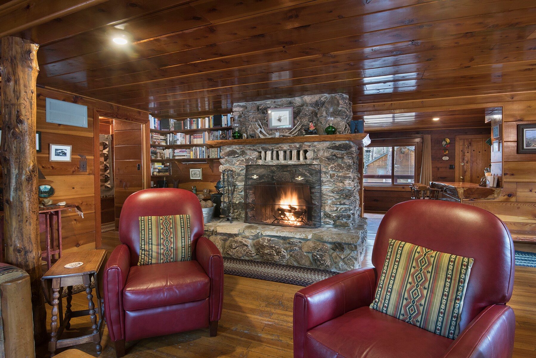 Relax in the living room and warm yourself next to the river rock fireplace.