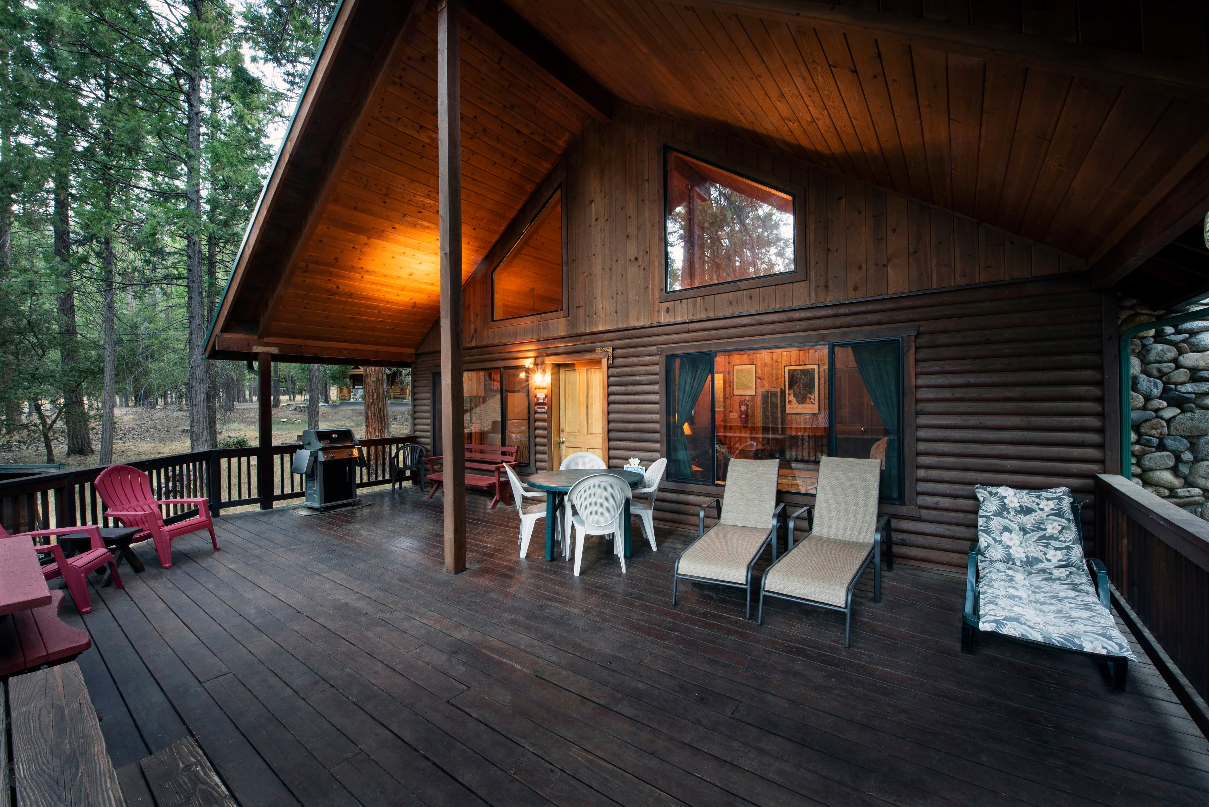 Front of cabin and its relaxing wood covered deck for all year-round BBQ experience.