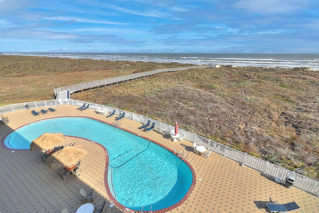 Community pool with boardwalk to the beach. Community pool with pedestrian boardwalk to the beach
