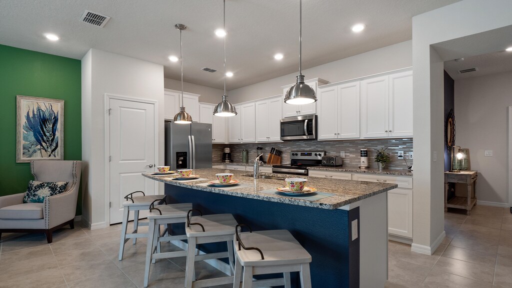 Fully stocked kitchen & dining space - gather, cook, and enjoy meals together in style