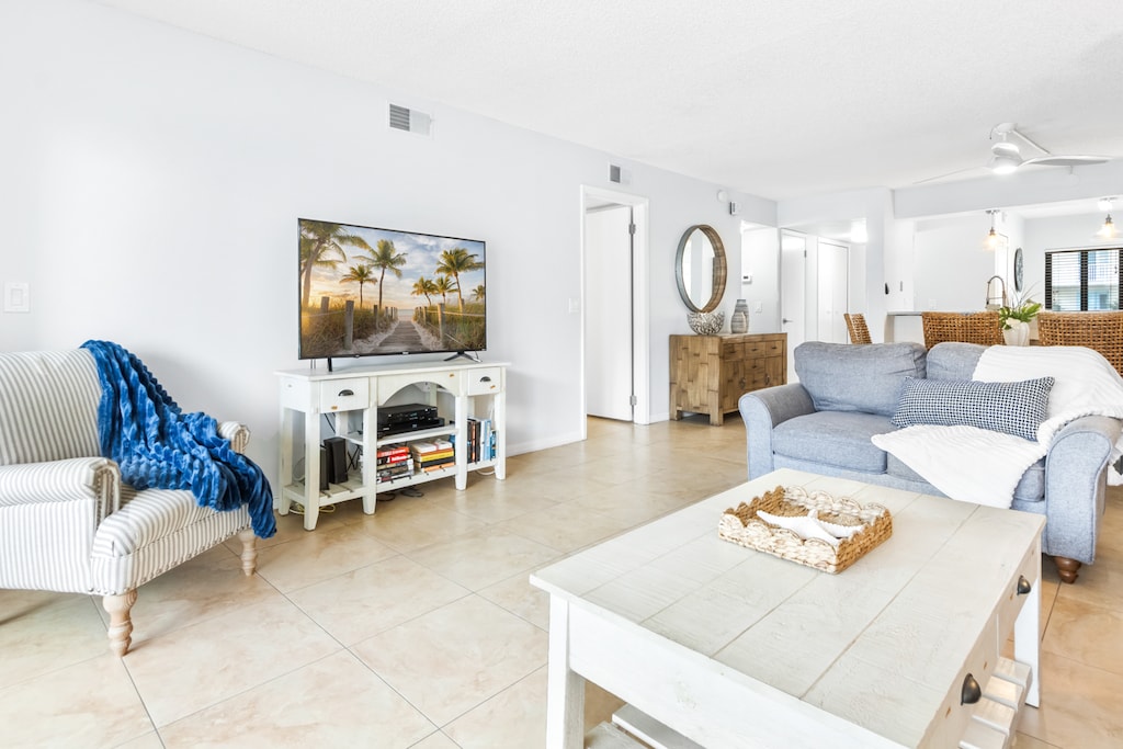 Living room with walkout balcony, 55" TV & QUEEN sofa sleeper