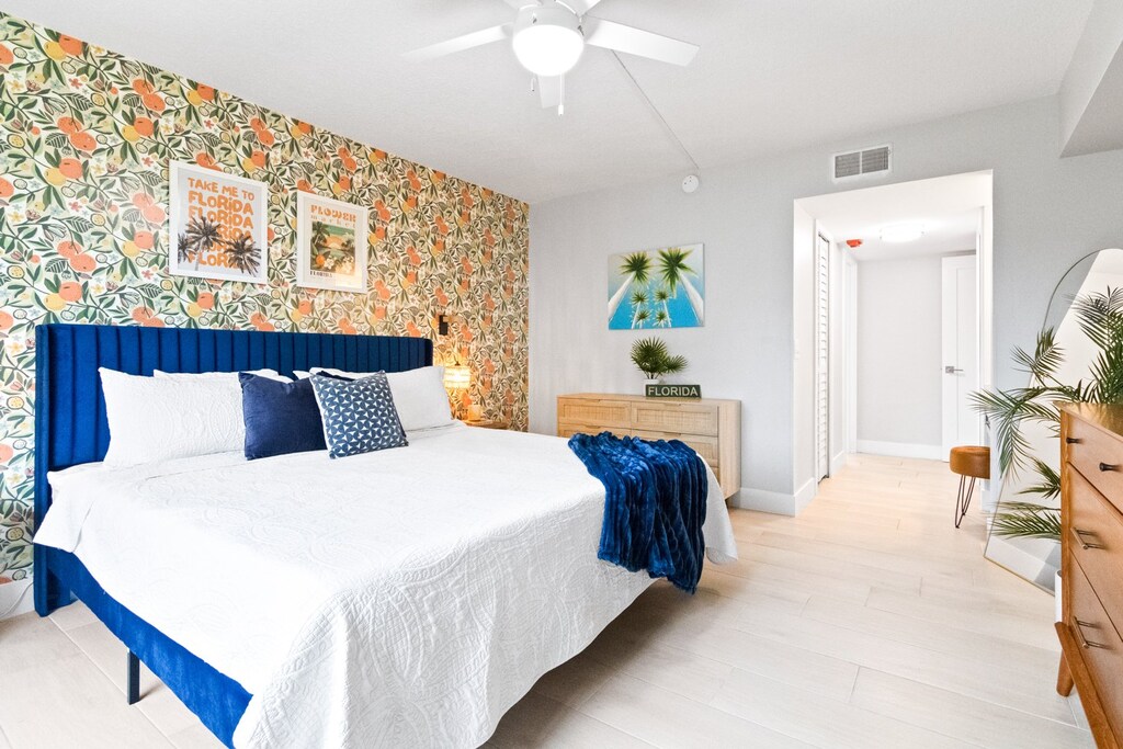 Sleep in style in this Florida-inspired bedroom with bold colors, fun patterns, and lots of natural light.