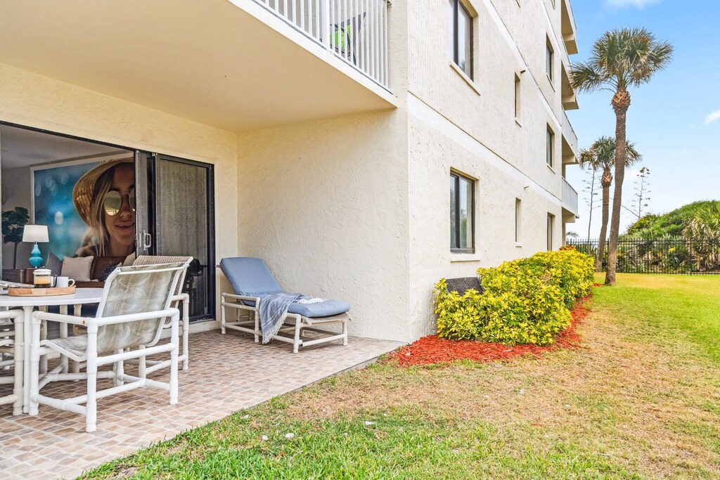 Private ground-floor patio perfect for lounging, reading, or sipping coffee in the coastal breeze.