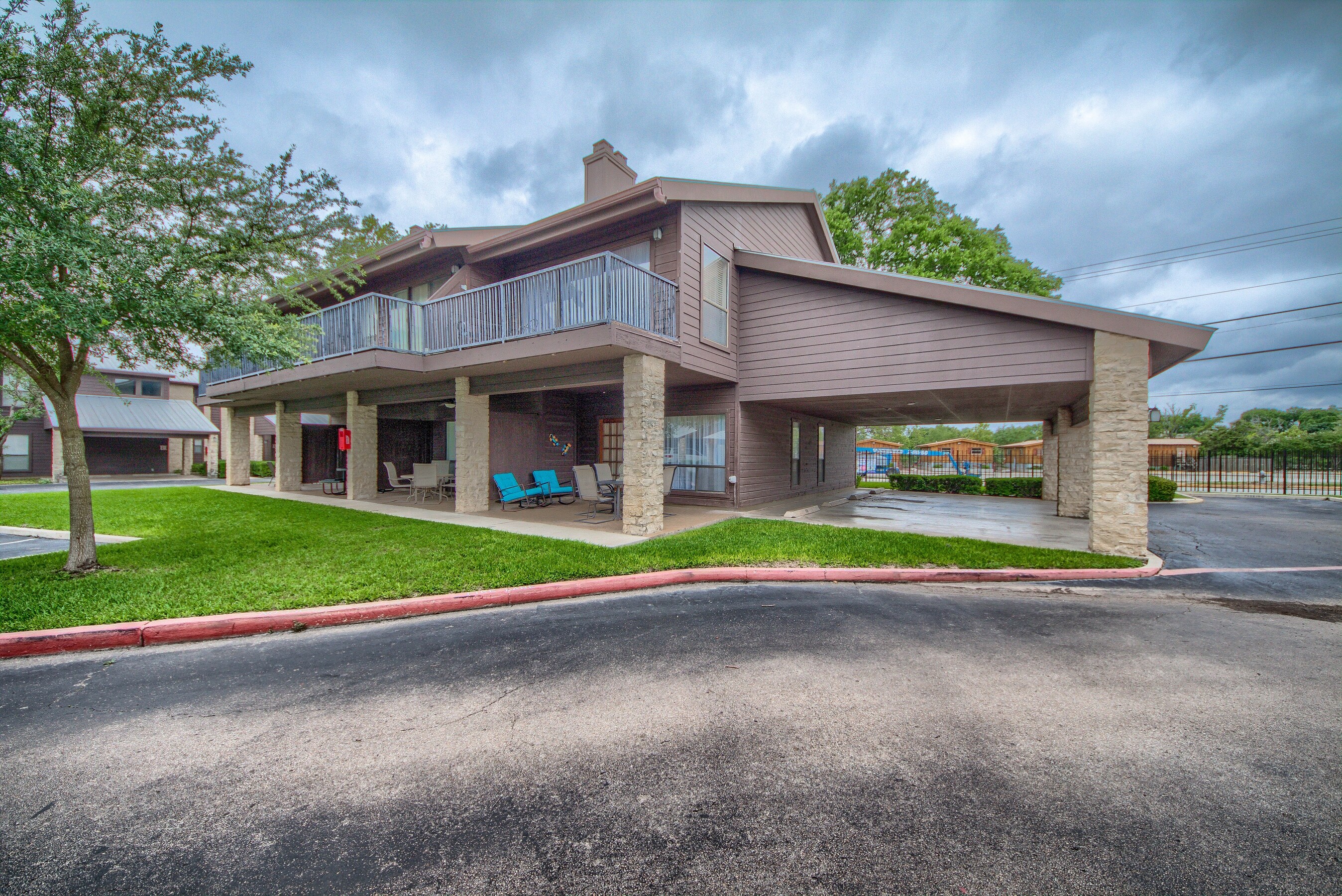 Corner unit with ground level entry and a covered parking spot.