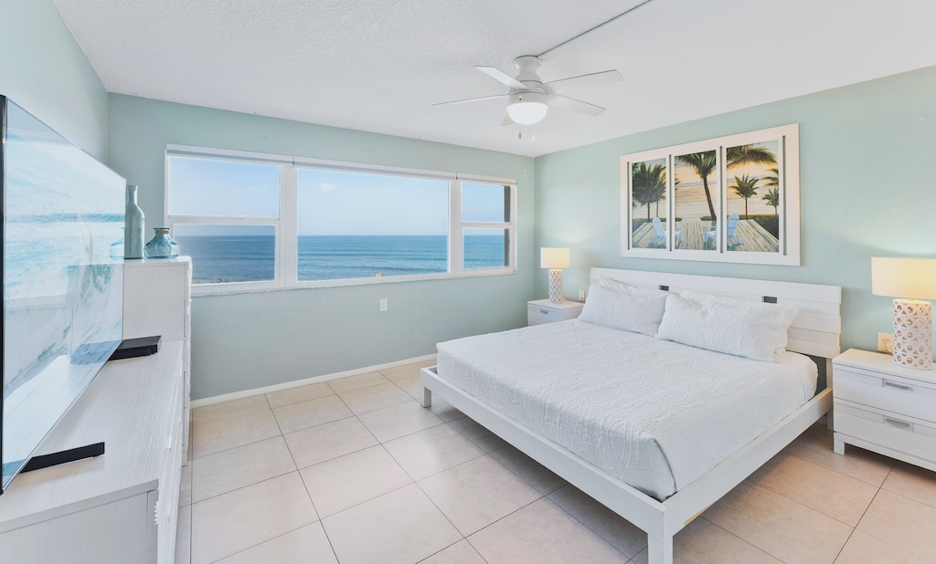 Master bedroom with soft tones and a breathtaking view to start your day right.