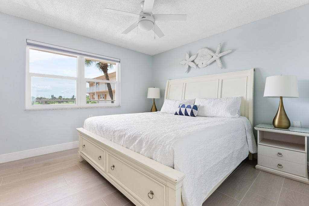 Master Bedroom: Plush king bed & TV