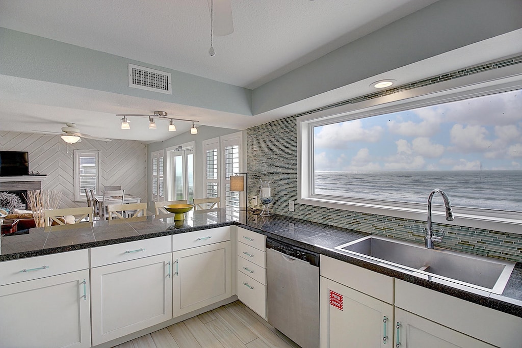 Full kitchen with views and bar seating . Kitchen with views from 30 foot picture window! 