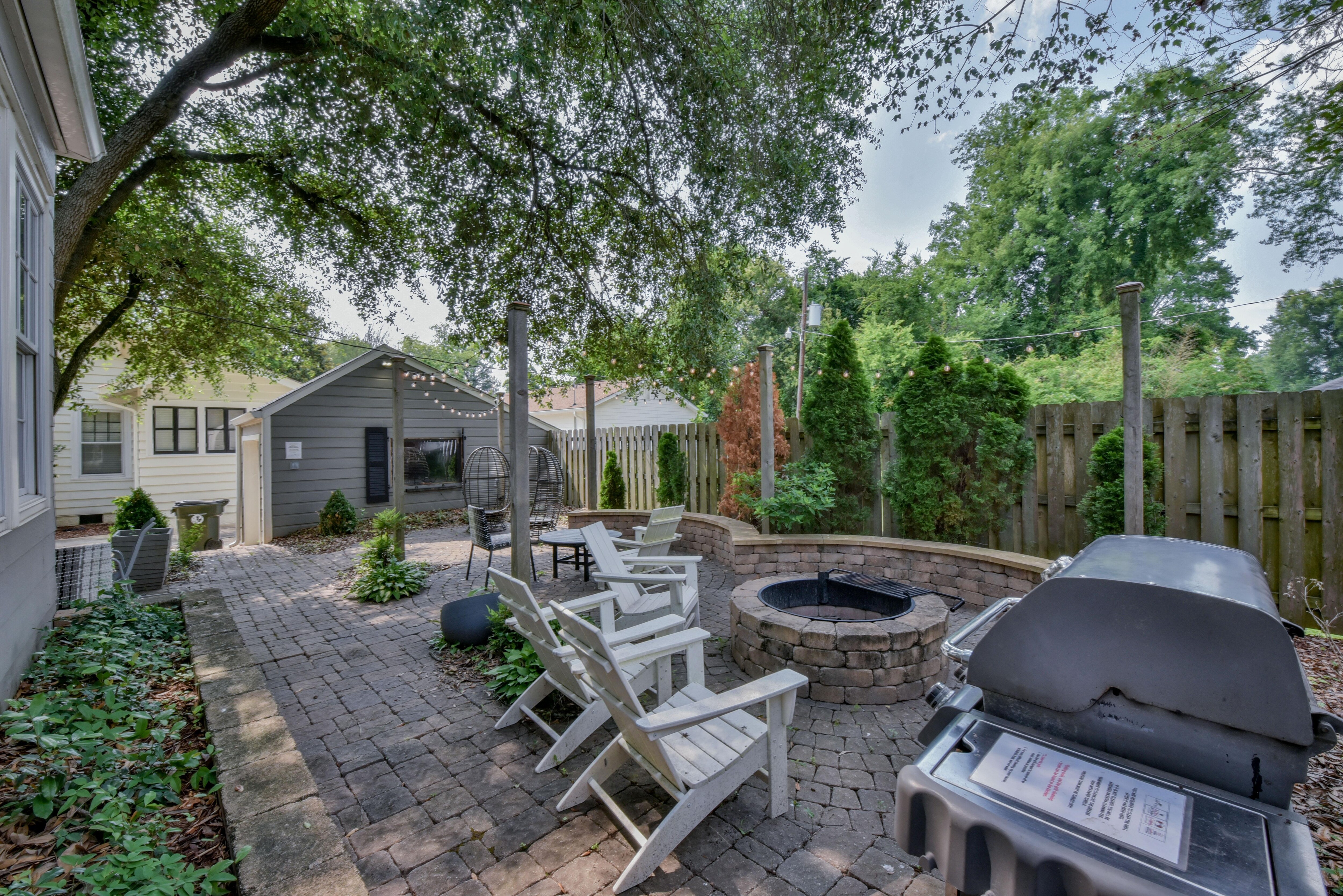 The backyard is the perfect gathering space for your group. There is a grill, fire pit, and plenty of seating!