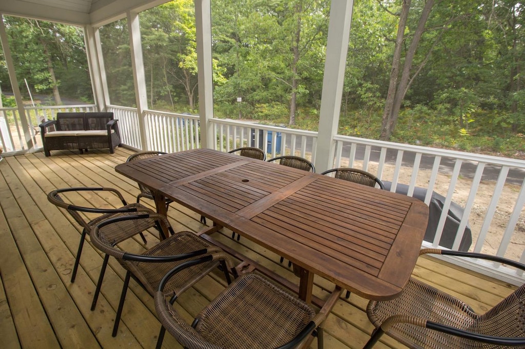 Back screened in porch has new outdoor furniture for all to enjoy.