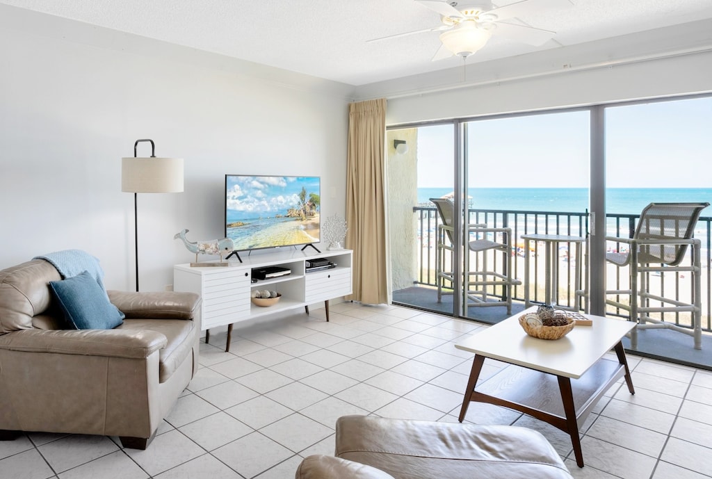 Bright and inviting living room with a private balcony and ocean views