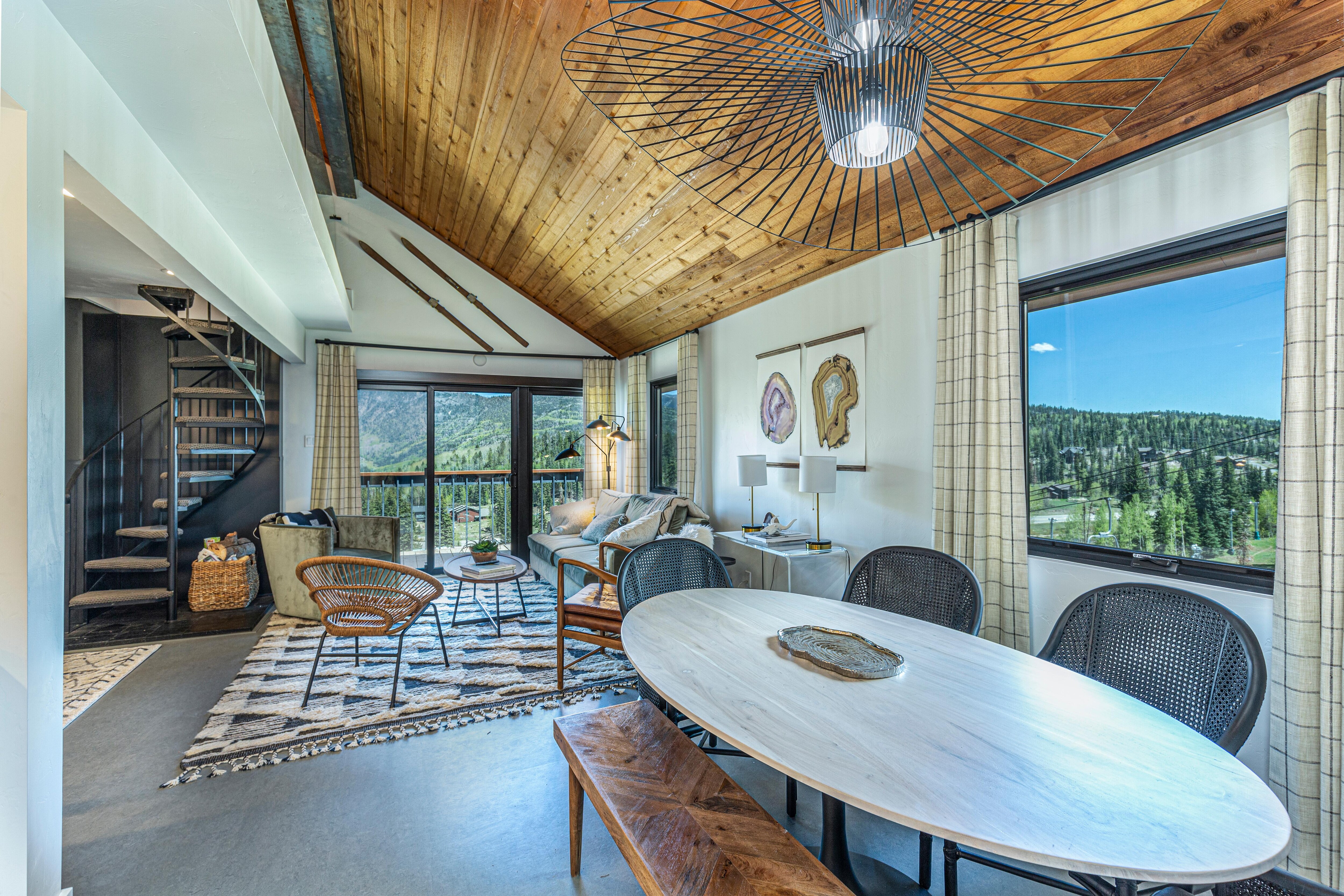 Main living space with mountain views, deck and Queen pullout sofa bed.