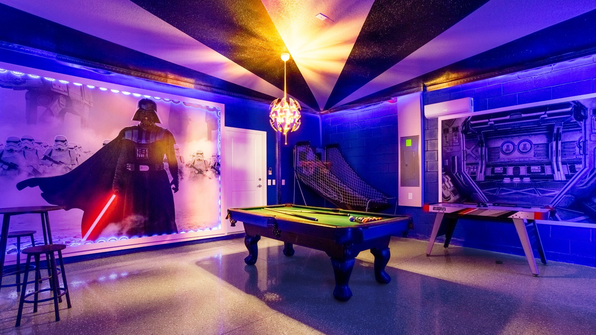 The game room is stylishly furnished with Star Wars theme with cool lights