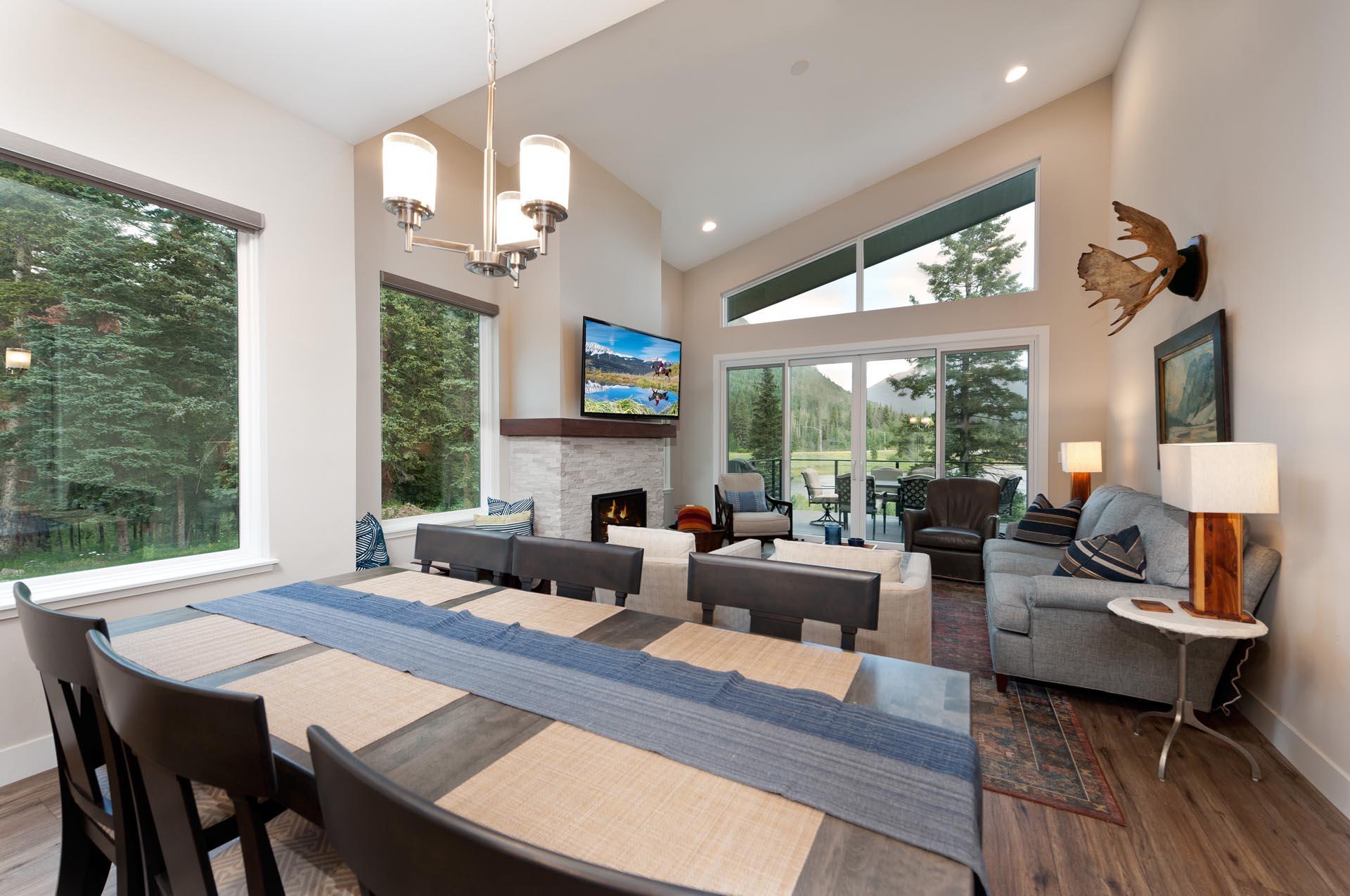 Main Living Space and Dining Spaces (TV, Gas Fireplace, Deck, Views and plenty of windows 