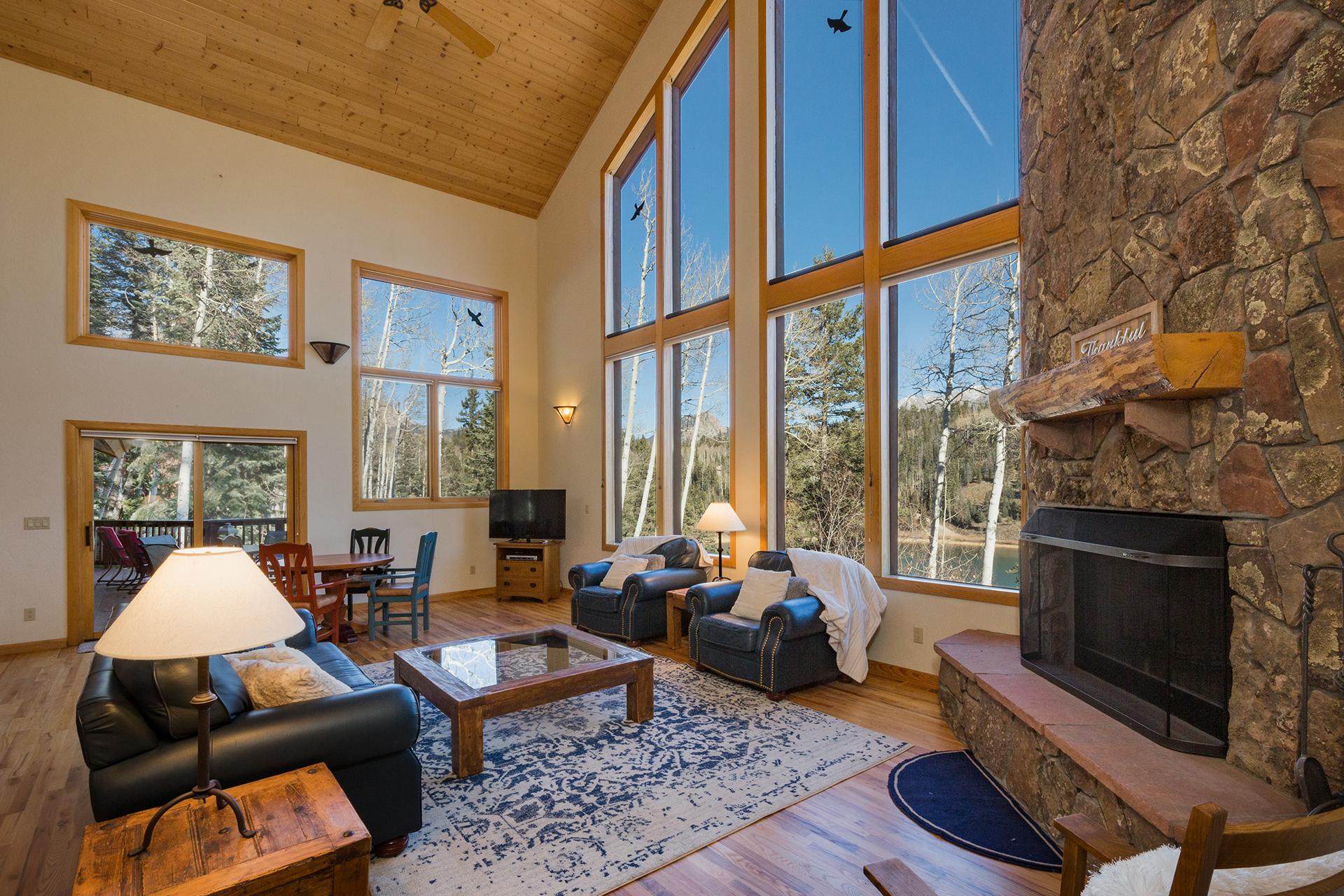 Main Living Space - Views of Columbine Lake, TV and Wood Burning Fireplace