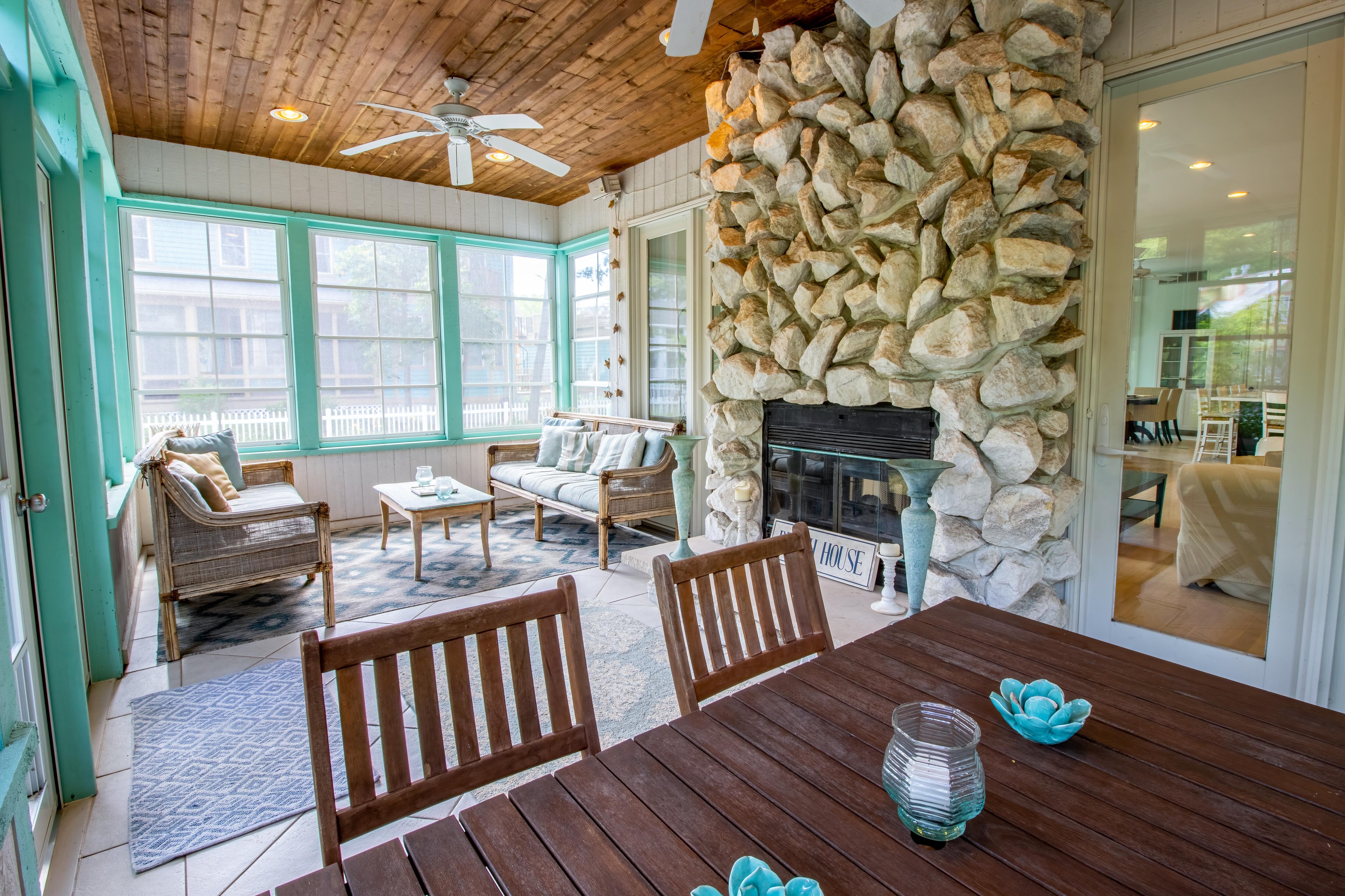 Main level 4 seasons porch with fireplace
