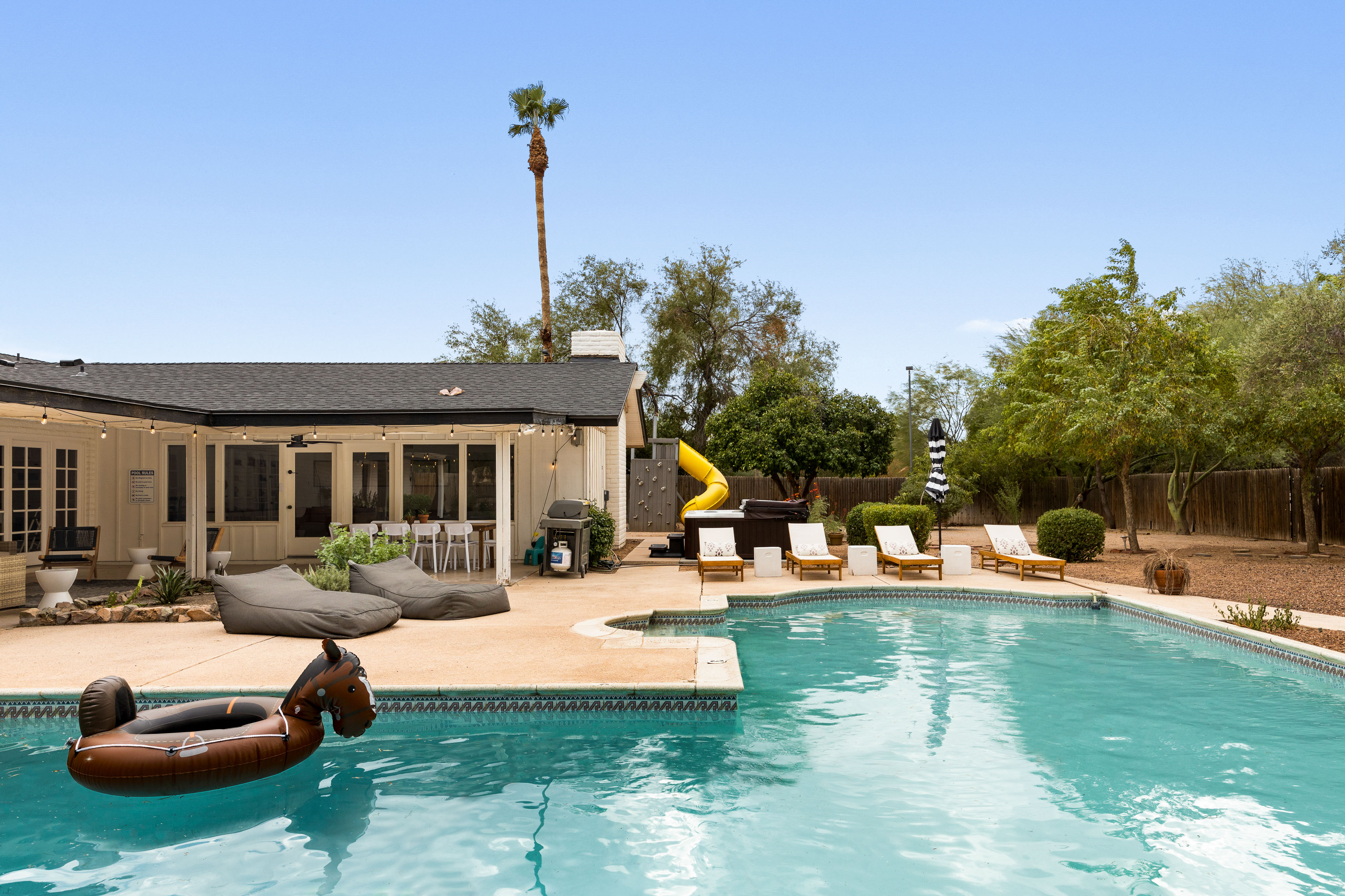 Relax in the Outdoor Pool Area w/ Poolside Lounge Beds!