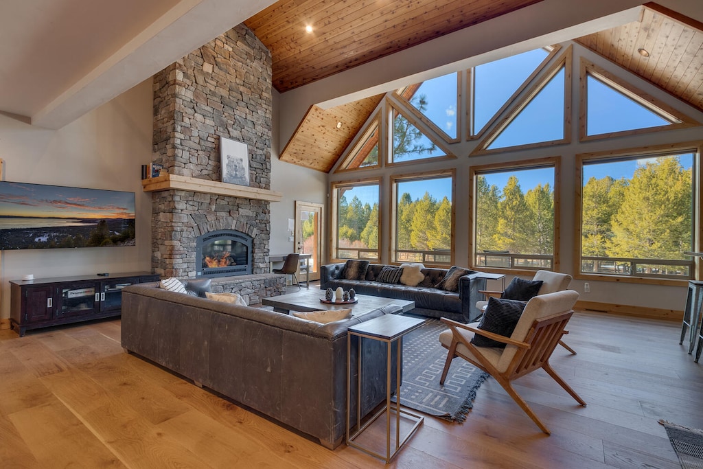Living area with fireplace and cathedral windows