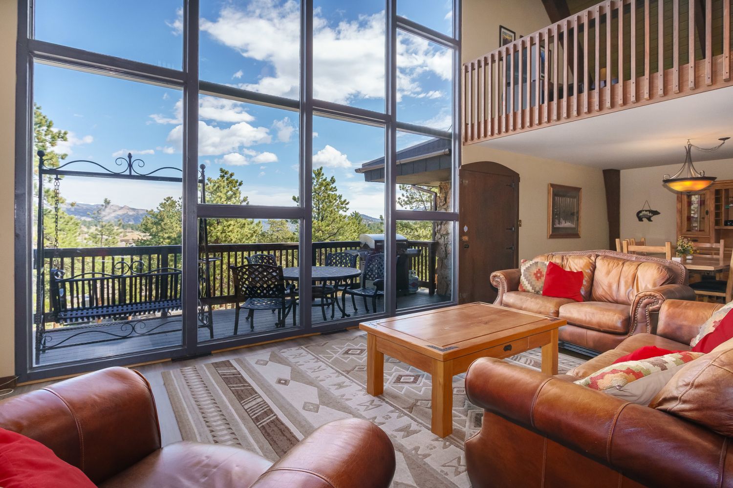 Sky View in the Rockies - Open concept floor plan with cathedral ceiling and floor to ceiling windows. 