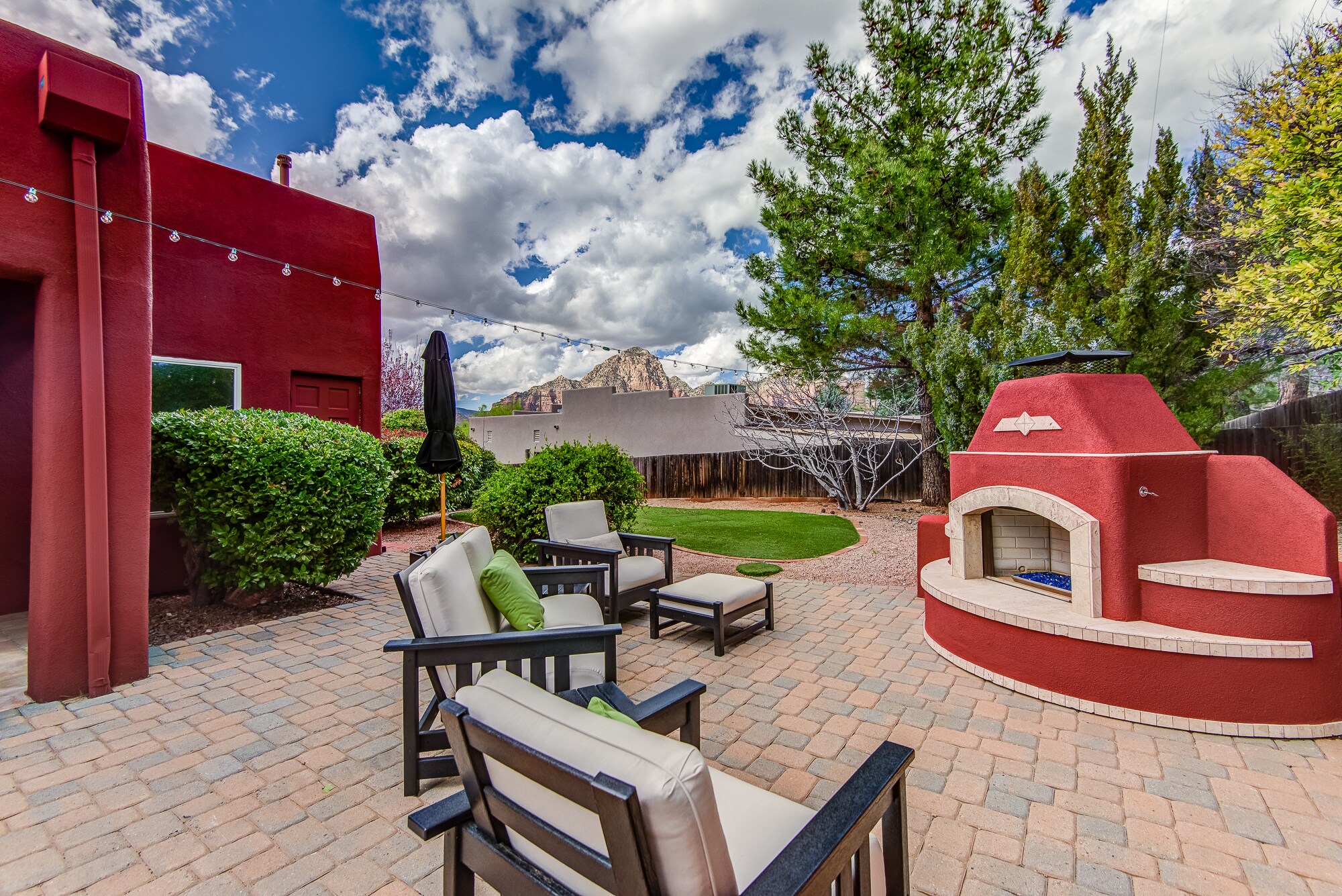 New Outdoor Gas Fireplace and Seating Area with Red Rock Views