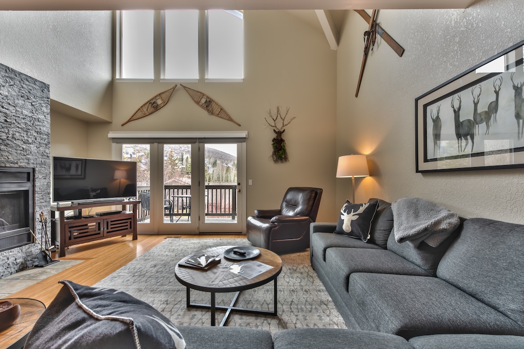 Living room with fireplace, 55" HD Smart TV & DVD, Deck Access