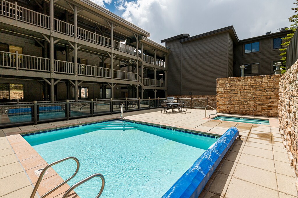 Communal heated pool, hot tub, patio seating and BBQ