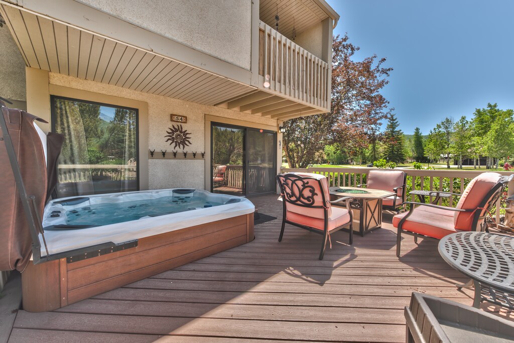 Large deck with comfortable seating, and 8 person Bullfrog Hot Tub
