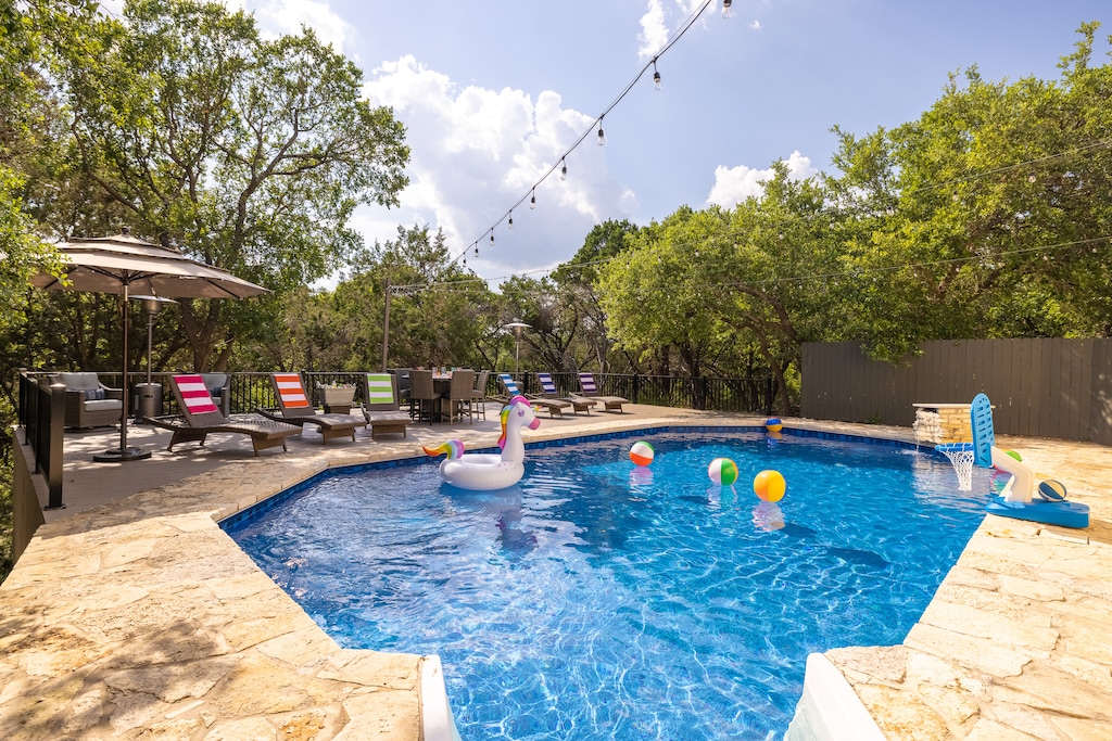 Heated pool and sky deck with pool toys and basketball hoop for all ages, plus lots of lounge seating