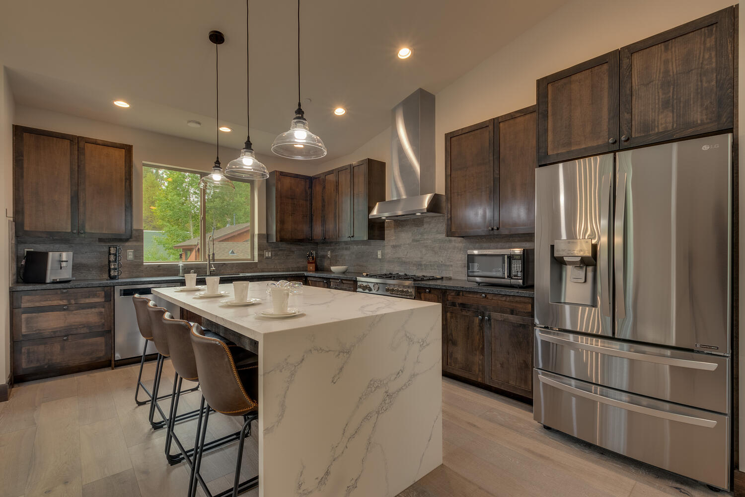 Kitchen area with stainless-steel appliance and breakfast counter