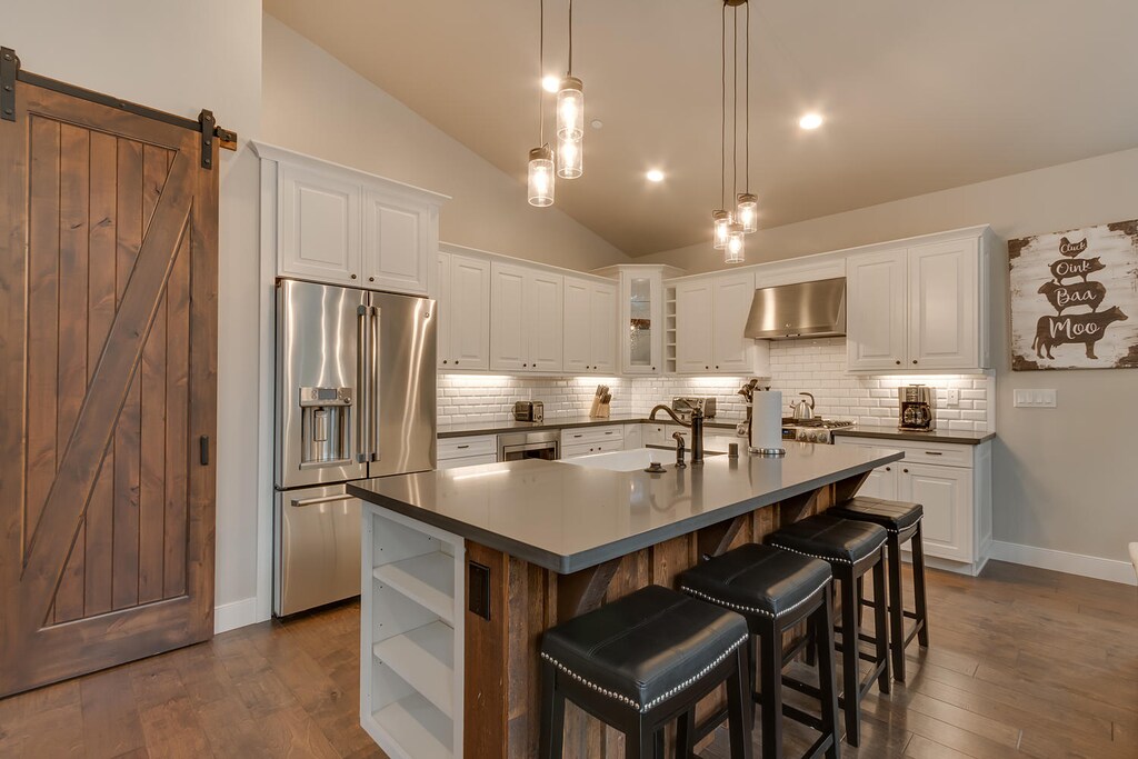Kitchen area with stainless-steel appliances and island