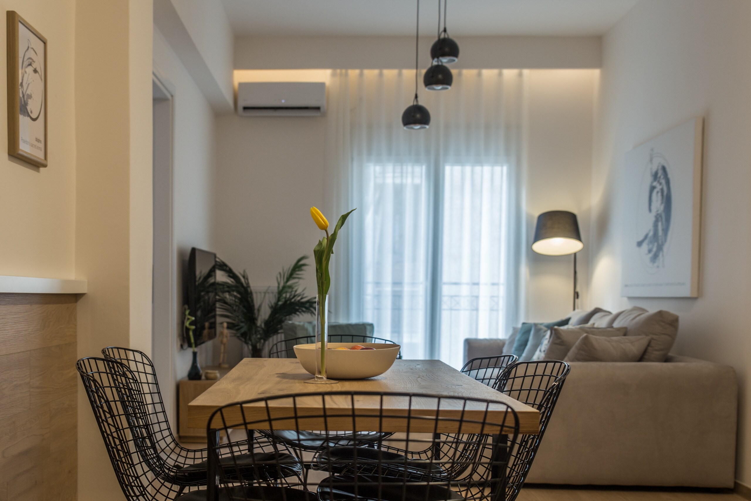 

A fully renovated apartment in the heart of Athens, with three bedrooms, a living area with a seating and a dining area, a full kitchen and two luxurious bathrooms with cabin shower.The dining area is open to the seating area and the kitchen.